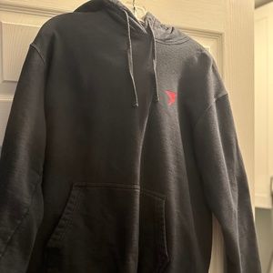 Black hoodie wit red sign
